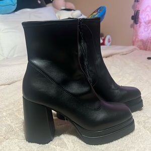 Black heeled boots.
